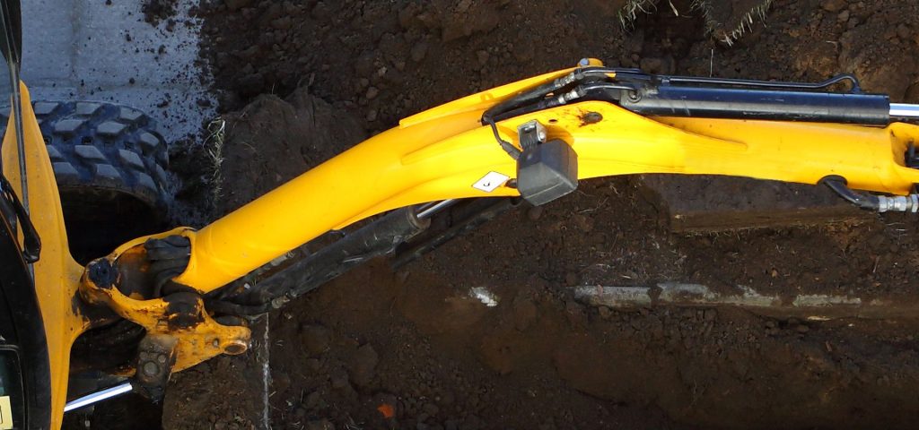 yellow Mini digger on construction site